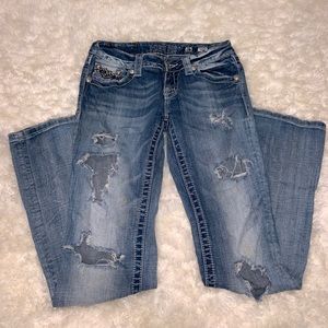 Distressed buckle miss me boot cut jeans